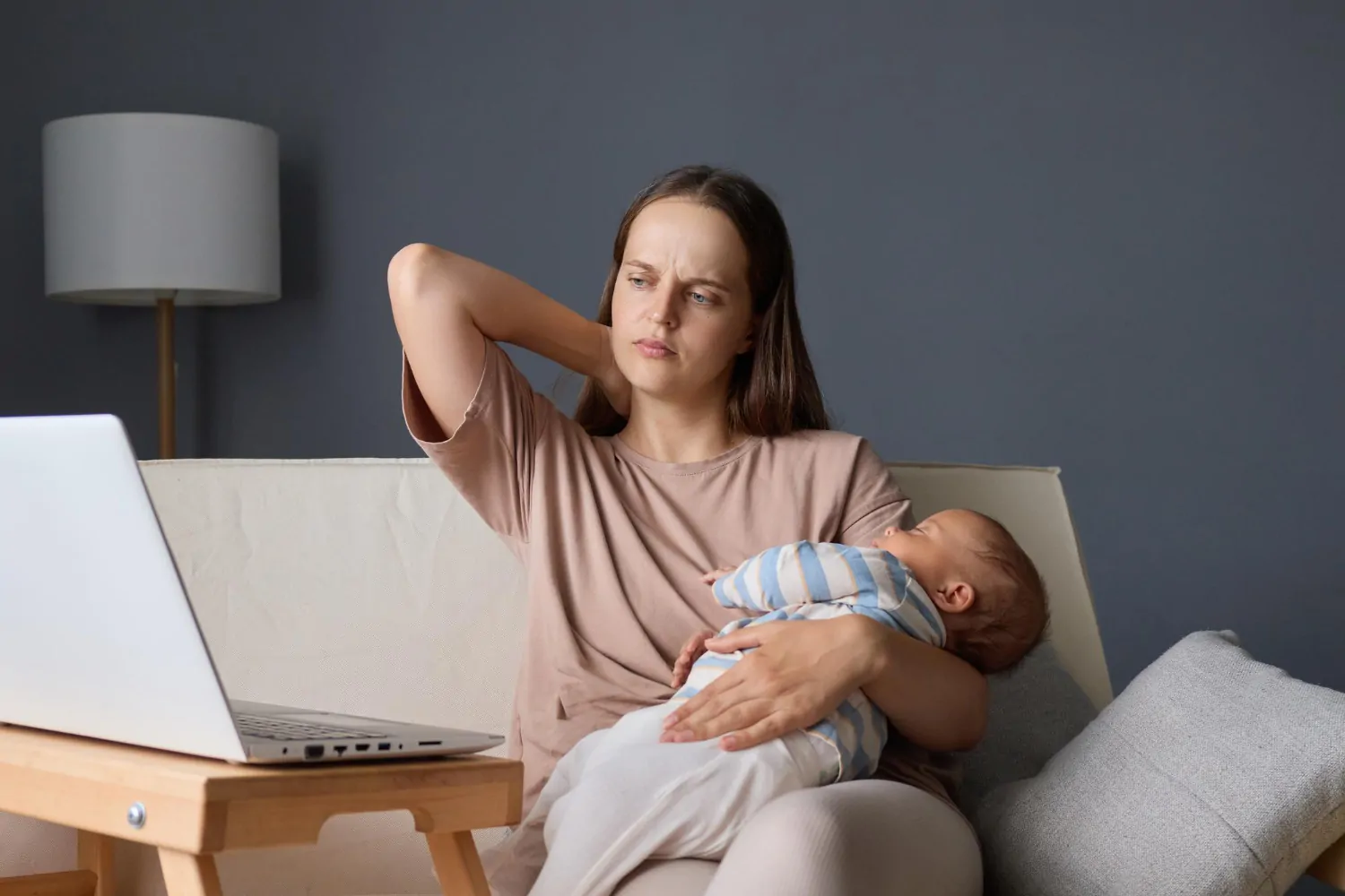 A woman holding a baby, highlighting the importance of maternal mental health.